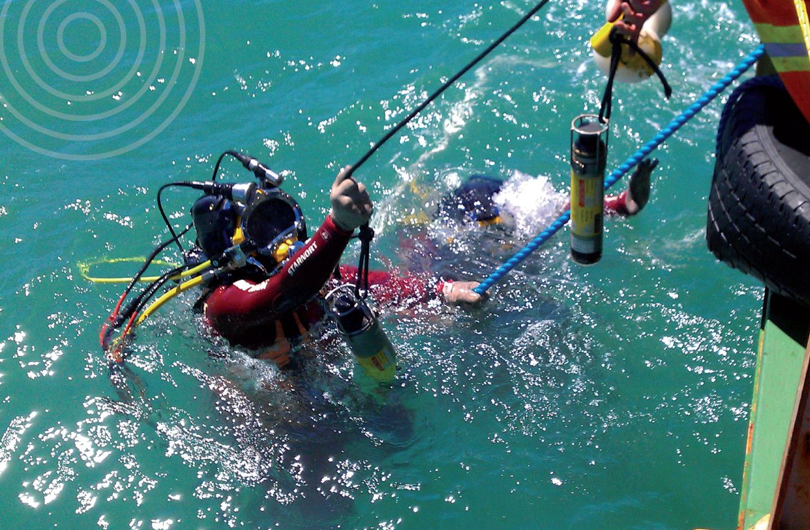 Diver with acoustic beacon